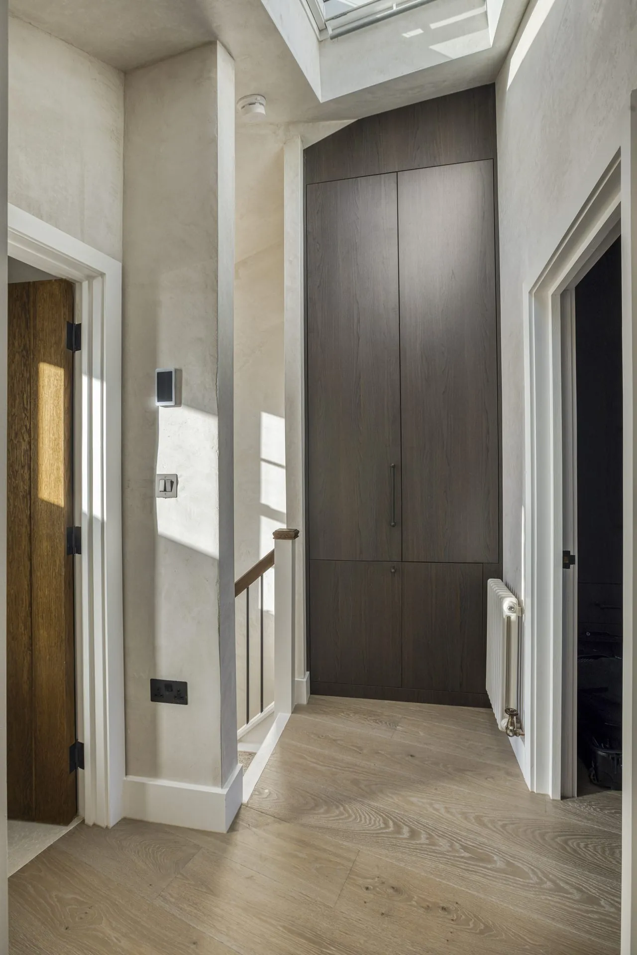 Interior of the top floor Notting Hill apartment with layered materials